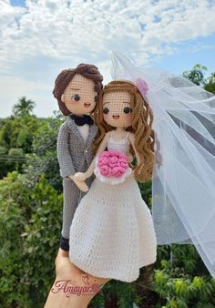 the bride and groom are posed on top of each other in their wedding day attire