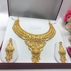 "Handmade Indian Bridal Wedding Jewelry 22ct Heavy Gold Plated Necklace Set with Earrings Indian Jewelry Indian Bollywood Jewelry , its Artificial Jewelry  Type :22ct Gold Plated Necklace Set Earrings Length: 2\"inches Approx Shape - As Shown in Picture It is a perfect match with formal attire on special occasions or with casual wearing Comes in Jewellery Gift Box Traditional Indian Wedding Jewellery Slight Colour variations possible due to difference in screen and photograph Care instructions K Gold Plated Jewelry Sets For Marriage, Gold Plated Bridal Sets For Marriage, 22k Gold Hallmarked Bridal Necklace For Wedding, Gold Bridal Sets For Marriage, Ceremonial Gold Hand Set Jewelry Sets, Ceremonial Hand Set Gold Jewelry Sets, Ceremonial Yellow Gold Hand Set Jewelry Sets, Gold Temple Necklace For Marriage And Festivals, Gold Bridal Necklace For Marriage And Diwali