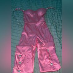 It’s A Extra Small Pink Jumpsuit Most Likely A Party Outfit. Pretty Sure It’s Custom-Made. Don’t Know Who It’s By But I’m Pretty Sure That It’s Definitely Custom-Made. Doesn’t Have Cheap Fabric Nothings Missing, Torn Stains. It’s In Perfectly Good Shape. Glamorous Satin Jumpsuits And Rompers For Spring, Glamorous Spring Satin Jumpsuit, Summer Party Satin Jumpsuits And Rompers, Sleeveless Pink Party Jumpsuits And Rompers, Strapless Pink Jumpsuits And Rompers For Night Out, Strapless Pink Jumpsuit For Night Out, Spring Satin Fitted Jumpsuits And Rompers, Fitted Satin Jumpsuits And Rompers For Spring, Spring Party Satin Jumpsuits And Rompers