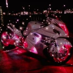 a futuristic motorcycle parked on the street at night