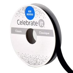 a reel of black ribbon with the words celebrate it