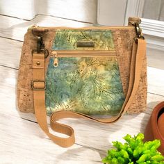 This Sunshine crossbody bag in Cork and Batik  has a removable, adjustable strap from 30" (shoulder) up to 55" (crossbody).  The strap is made of 1" cotton webbing.  The bag measures 10.5" across the top, 11.5" across the bottom, 8" tall, and 2.5" deep.    It also includes a removable key fob.  It has a 6" outside zipper pocket and a 7" inside zipper pocket. Key Fob, Cross Body Handbags, Purses And Handbags, Zipper Pocket, Batik, Cork, Adjustable Straps, Crossbody Bag, Bathing Beauties