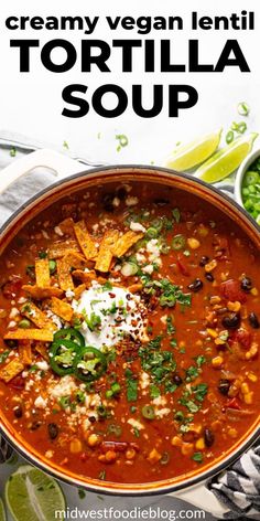 a large pot filled with tortilla soup and garnished with sour cream