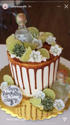 a birthday cake decorated with flowers and bottles