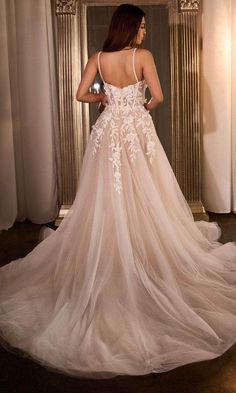 a woman in a wedding dress looking back