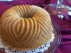 a bundt cake sitting on top of a glass plate