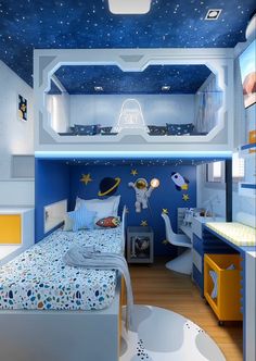 a child's bedroom decorated in blue and white with space themed decor on the ceiling