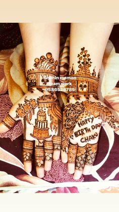 two hands with henna designs on them and the words happy new year written in arabic