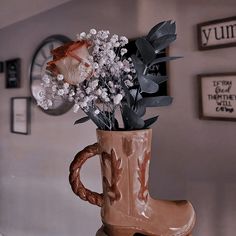 a vase filled with flowers sitting on top of a table