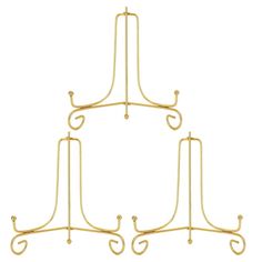 three gold metal racks with hooks on each side and one hanging from the top to the bottom