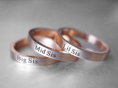 Today on Sale 35% off, use this coupon code at checkout:    giftforsisters35      Set of 3 handcrafted rose gold rings engraved with "Big Sis", "Mid Sis", and "Lil Sis". The silver color is available as well.  This 3 sisters ring set is the perfect sister gift to show your bond to your sisters. I can hand stamp "Big Sis" & "Mid Sis" & "Lil Sis"... Or I can stamp "Sisters" or "Sister" on your choice.  It's stainless steel band measuring 2mm in thickness, very sturdy and strong, chic design. It's available for you to engrave sister names on the inside.  It will not fade, tarnish or stain your skin. Stainless Steel is also a very durable metal, so it can stand up to everyday wear and tear. What's more, it is a comfort fit band, giving you a wonderful feeling.     I T E M ∙ D E T A I L S    Fi Sister Rings, Moonstone Engagement Ring Set, Rose Gold Rings, Bff Jewelry, Little Sister Gifts, Coordinates Bracelet, Jewelry Big, 3 Sisters, Black Gold Jewelry