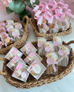 several small baskets filled with cupcakes and cookies