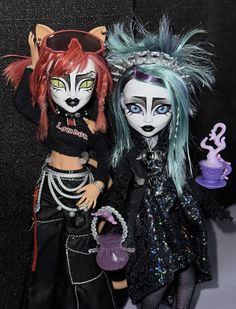 two dolls dressed up as cats and mice