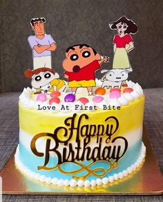 a birthday cake with cartoon characters on it