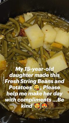 potatoes and green beans are being cooked in a skillet on the stove top,