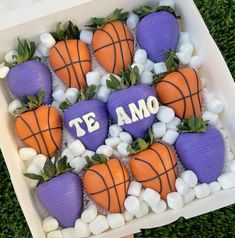 there are some strawberries and carrots in the shape of basketball balls with words te amo on them