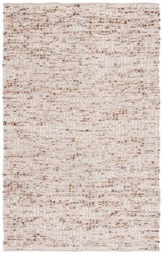 a white and brown rug with small squares on the bottom, in different shades of beige