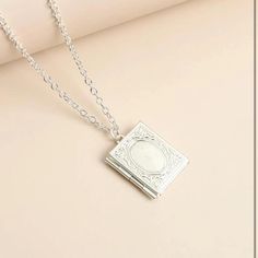 Never Worn Zinc Alloy Silver Book Charm Necklace That Opens For Photos. Chain 19.7 Inches Long. Book Charm, Genuine Pearl Necklace, Book Necklace, Peacock Pendant, Book Locket, White Pearl Necklace, Black Bead Necklace, Gold Pearl Necklace, Pendent Necklace