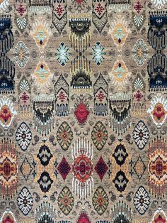 an area rug with many different colors and designs