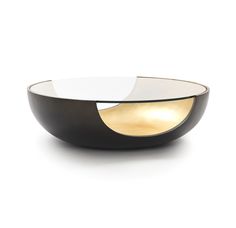 a black and white bowl sitting on top of a table