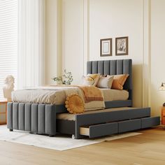 a bed that is sitting on top of a hard wood floor in a room with white walls