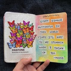 someone is holding up a book that has butterflies on it and the words, every single butterfly in this world finds its way to my stomach