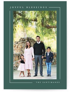 a family christmas card with the words merry christmas and an image of two adults, one child