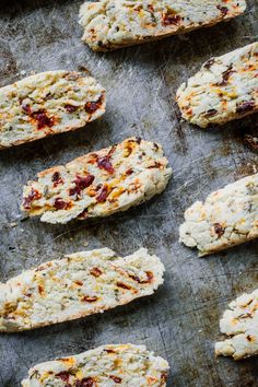 some food that is laying out on a baking sheet and ready to be baked in the oven