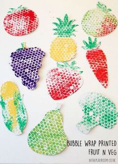 the paper cut outs are made to look like fruit