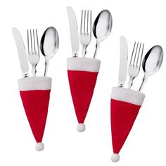 four forks and two spoons in santa's hat with silverware on them