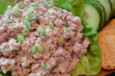 lettuce, cucumber and tuna salad with crackers on the side