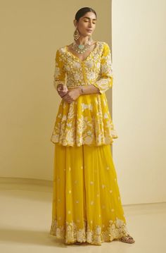 Yellow Indian outfit, yellow Indian outfit for haldi, yellow Indian outfit simple, yellow Indian outfit for haldi simple, yellow Indian outfit anarkali suit, yellow outfits, yellow outfit, yellow outfit aesthetic, yellow outfit ideas, yellow outfit for haldi function, yellow saree look, yellow saree wedding, yellow saree for haldi bride, yellow saree with contrast blouse, yellow lehenga, yellow lehenga for haldi, yellow lehenga bridal, yellow lehnga dress, yellow haldi outfit, Peplum With Sharara, Yellow Sharara, Varun Bahl, Haldi Dress, Sharara Designs, Haldi Outfit, Function Dresses