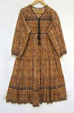 "ITEM DESCRIPTION brown paisley printed cotton long maxi dress - v neckline with tassel Indian maxi dress - long sleeve casual maxi dress Features: Long sleeve, V neck, Long dress Material: Cotton Voile Fabric: 100% cotton soft light weight ethnic print fabrics Sleeve Length = 22 inch For more sizes & their measurement, please refer our below chart to understand the sizes variations available with us For your size requirement, please mention your size in seller note at the time of buying. IMPORT Brown V-neck Boho Dress For Fall, Cotton Maxi Dress For Fall Beach, Cotton Maxi Dress For Fall Beach Outings, Cotton Maxi Dress For Beach In Fall, Hippie Cotton V-neck Maxi Dress, Cotton Maxi Dress For Fall Vacation, Fall Vacation Cotton Maxi Dress, Brown V-neck Maxi Dress For Festival, Brown Printed Long Sleeve Maxi Dress