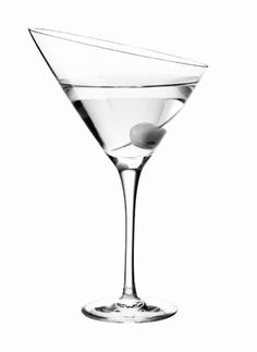 a martini glass with an olive garnish on the rim and a white background