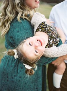 a woman holding a small child in her arms