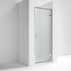 an empty white room with a glass shower door on the wall and no one in it