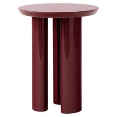 two red round tables sitting next to each other