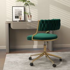 a green office chair sits in front of a desk with a potted plant on it