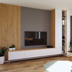 a living room with white furniture and wood paneling on the wall, along with a flat screen tv