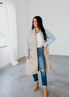 Layered look trench coat with denim jacket lining. Laurie is wearing a size small. Measurements: Body Length: 47" | Sleeve Length: 22" Small: Bust: 44" Waist: 42" Arm: 19" Medium: Bust: 45" Waist: 44" Arm: 19" Large: Bust: 46" Waist: 47" Arm: 20" Self: 66% Rayon 34% Polyester Contrast: 100% Rayon Denim Outerwear With Lapel Collar For Fall, Chic Cotton Outerwear, Chic Cotton Outerwear For Layering, Spring Denim Outerwear With Lapel Collar, Denim Outerwear With Lapel Collar For Spring, Oversized Denim Outerwear For Layering, Denim Outerwear For Fall Layering, Spring Outerwear With Lapel Collar For Day Out, Chic Denim Outerwear For Work