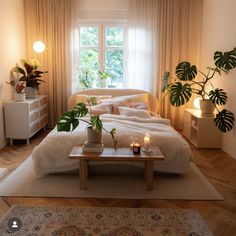 a living room filled with furniture and lots of plants on top of a wooden table