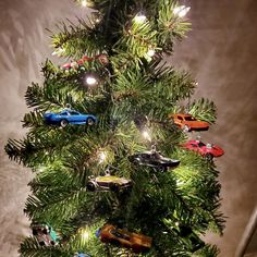 a christmas tree with toy cars on it