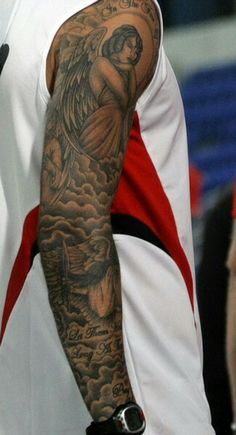 a man with a tattoo on his arm