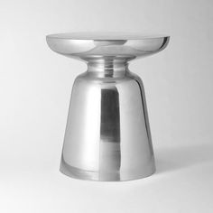 a silver plate sitting on top of a white table