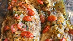 two fish fillets with tomatoes and green beans