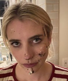 a woman with food all over her face