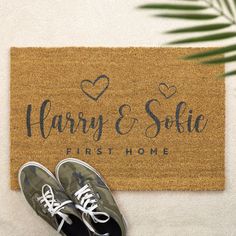 pair of shoes sitting on mat next to doormat with personalized name and date