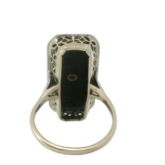 This stunning Black Onyx and Diamond Art Deco Ring features intricate filigree detailing and a bold black onyx centerpiece with a center diamond. A unique and timeless piece, perfect for adding elegant sophistication to any outfit. Jewelry Style : RingMetal Type : 14K Gold Diamond : 1 round diamond Ring Size : 6.75 : Can be sized by your jewelerBlack Onyx : Approximately 23mm x 10mmestate piece, sold as is, all weights are estimates Luxury Black Diamond Art Deco Ring, Luxury Art Deco Black Ring, Luxury Black Diamond Ring In Art Deco Style, Luxury Black Art Deco Diamond Ring, Luxury Black Art Deco Rings, Edwardian Onyx Rings, Diamond Art Deco Ring, Art Deco Diamond Rings, Outfit Jewelry