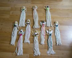 several tassels are laid out on the floor to be used as ornaments for an ornament