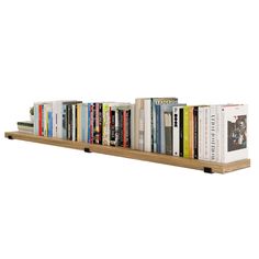 a bookshelf filled with lots of books on top of each other